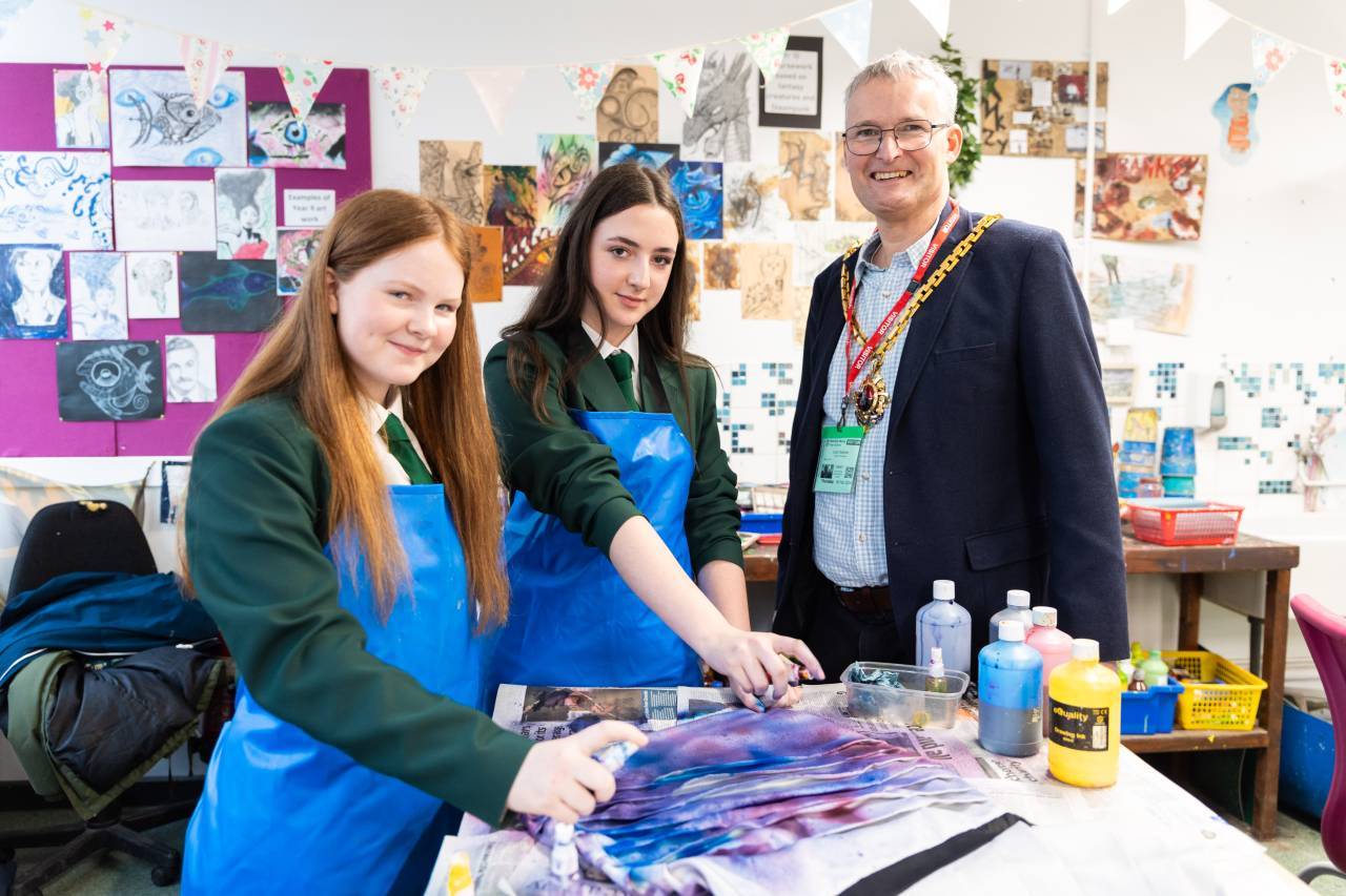Councillor Louis Stephen, the Mayor of Worcester, with year 9 pupils Rhiannon Lewis and Melody Preston, who are preparing clothes to be modelled and auctioned in aid of Age UK at the charity fashion show at The Guildhall on Thursday 14 March 2024