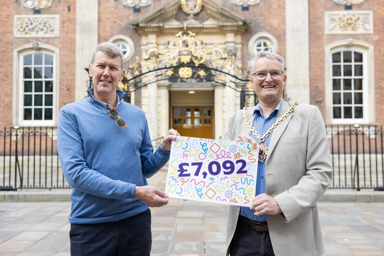 Outgoing Mayor of Worcester, Louis Stephen (right) presenting a cheque of £7,092 to Karel Bretveld, representing Age UK.