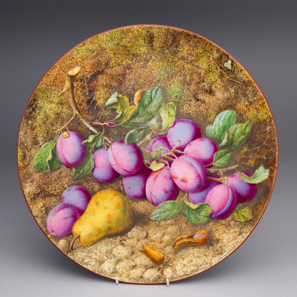 Worcester Porcelain Plate with plums and pears painted on the front.