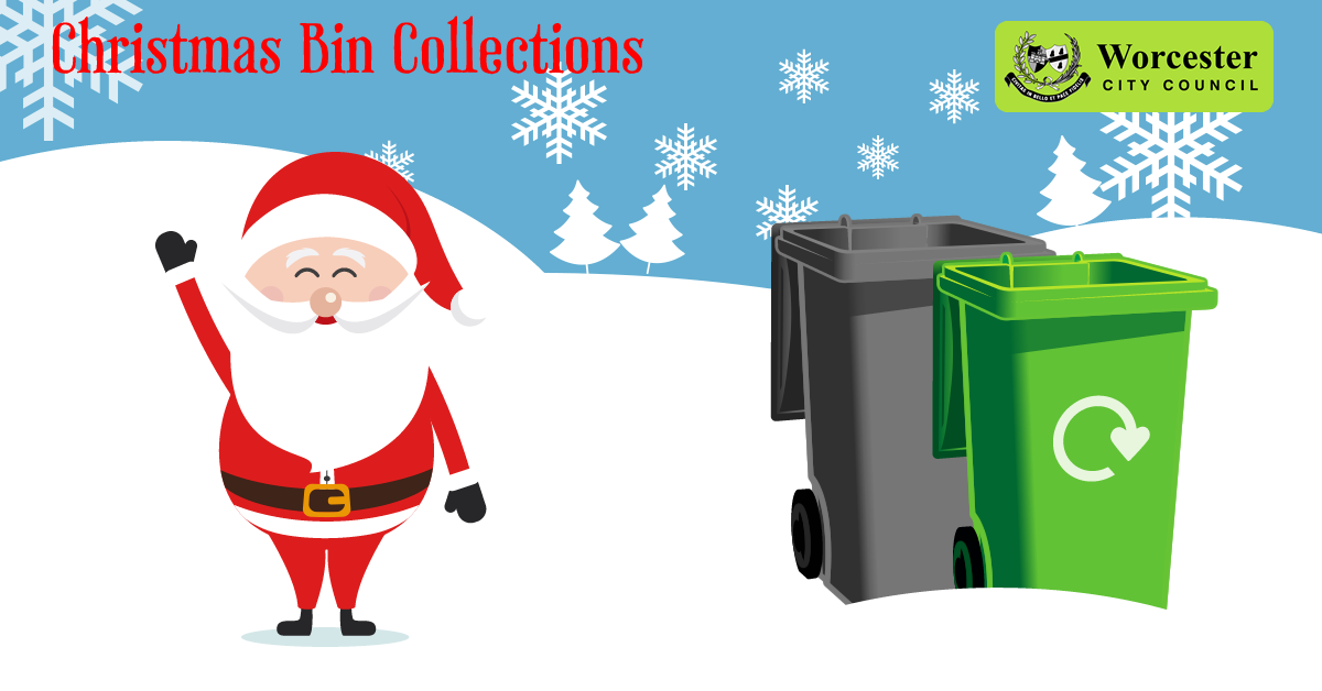 Santa waving in the snow by waste wheelie bins