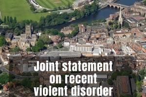 An aerial view of Worcester with a caption that reads, "Joint statement on recent violent disorder."