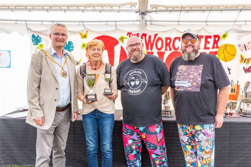 Former Mayor of Worcester Cllr Louis Stephen presenting a winner's trophy to Helen Platt at the 2023 Worcester Show, accompanied by the Bearded Growers