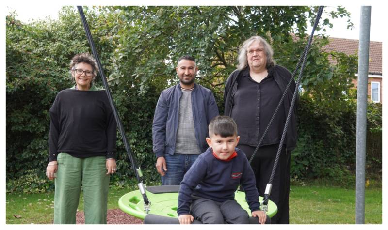 Standing are Leisa Taylor; Rayan’s father Zerivan Miru; Rayan Sney sat on the nest swing; Councillor Robyn Norfolk