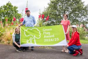 Holding a Green Flag Award 2024/25 flag are (left to right) Karen Lewing, Mark Worrall, Zoe Cookson and Kerry Castle